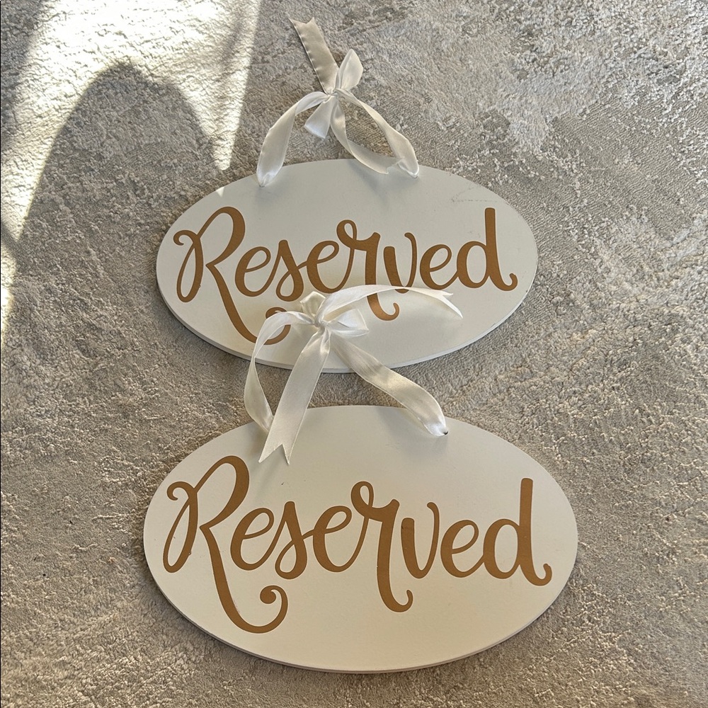 White and Gold Reserved Signs
